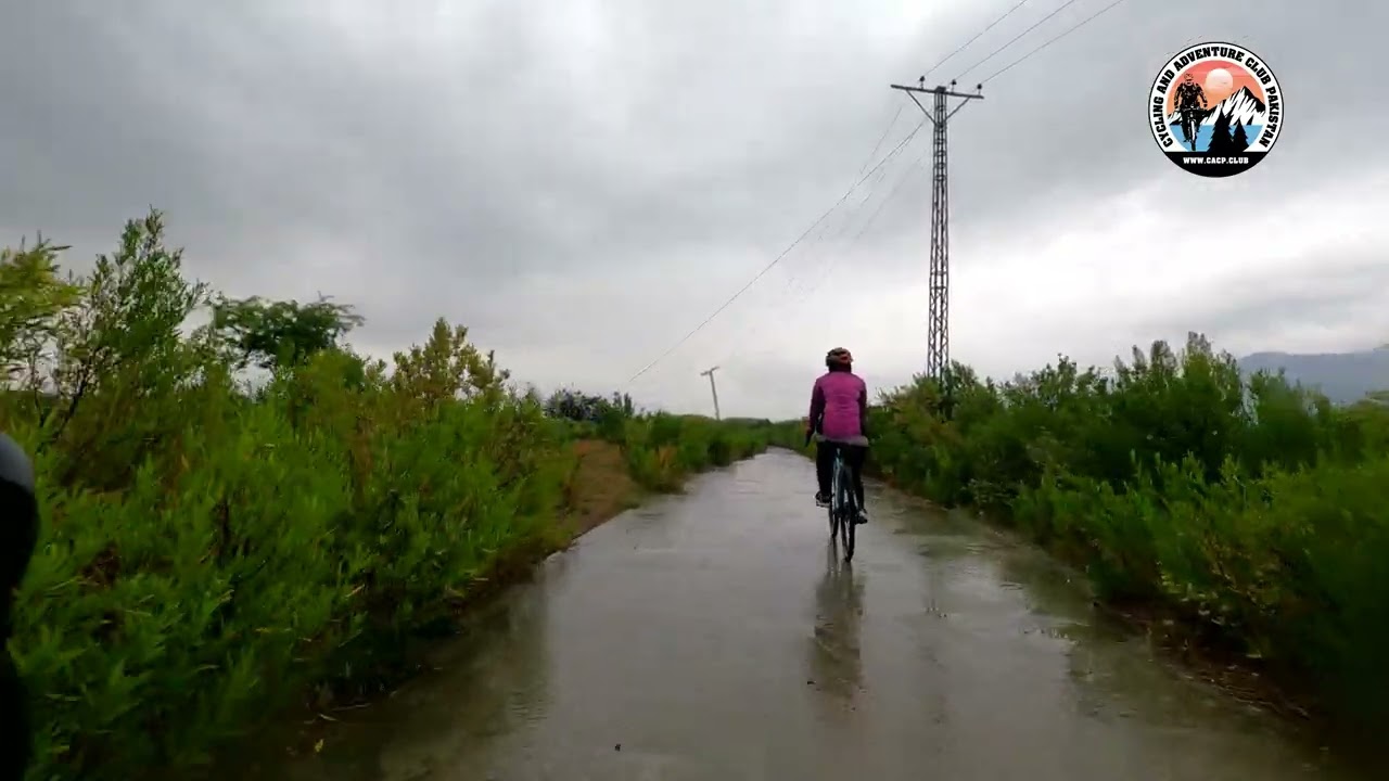 Riding along Indus River in rain - Cycling & Adventure Club Pakistan