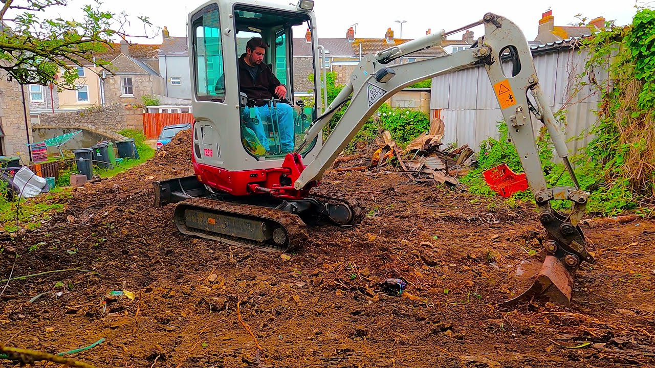 Mini digger moving rubbish ready for a grab lorry!! Takeuchi TB216 Excavator