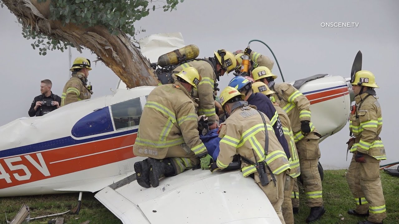 Plane Crashes into Tree Trapping Pilot and Passenger
