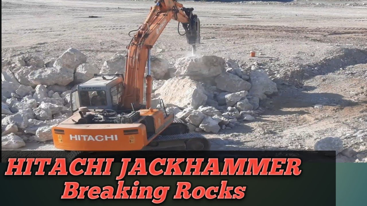 Hitachi 200 Jackhammer Breaking boulder stone in quarry.  heavy equipment.heavy machinery.excavator