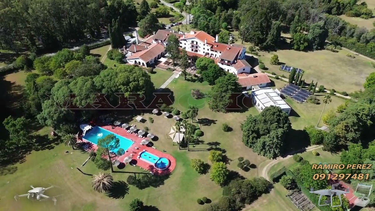 VIDEO DRON NUEVA HELVECIA COLONIA, RECORRIDA POR LA AVENIDA DE ACCESO Y VISTAS DEL HOTEL NIRVANA.