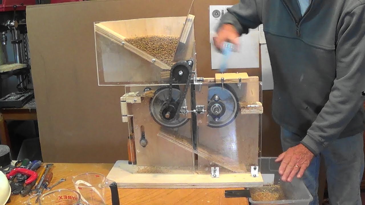 Low volume rice huller using urethane sheets on  steel rollers powered by hand, bike or motor.