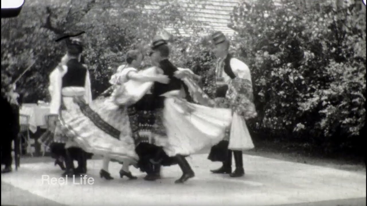 1946 People watching in Hungary,  traditional dress.