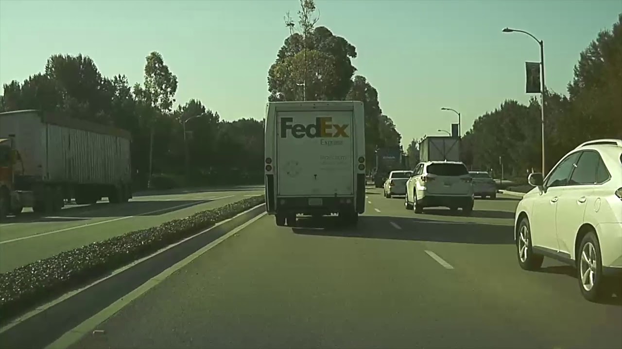 Porsche 911 racing Kia on Irvine streets. WTF
