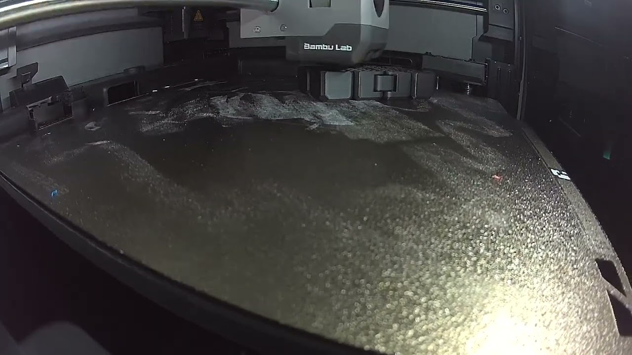3-d printing a black fidget cube toy.