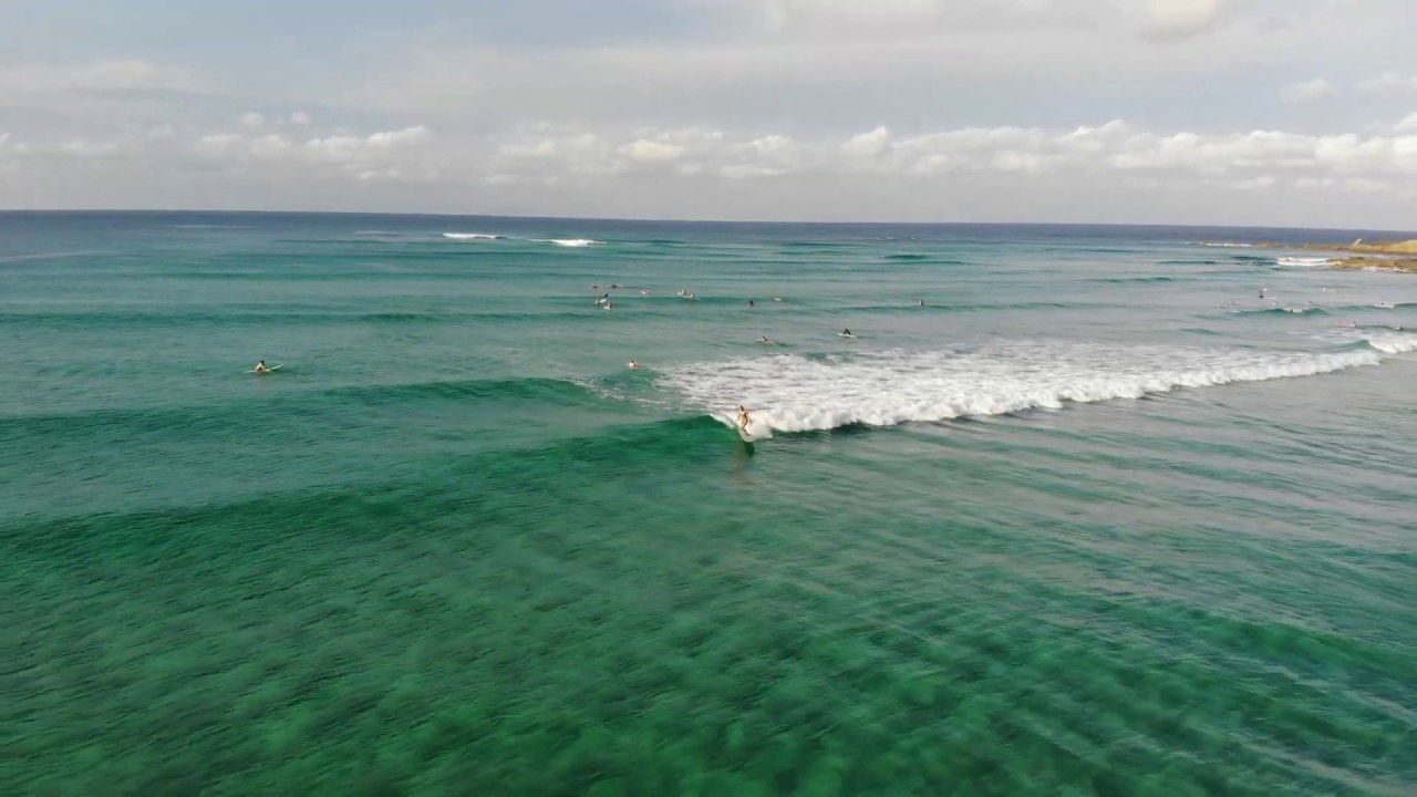 Longboard Surfing on Crystal Clear Wategos