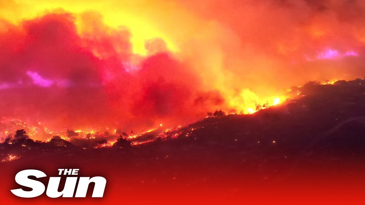 Greek wildfires: Rhodes continues to burn through the night forcing tourists to flee