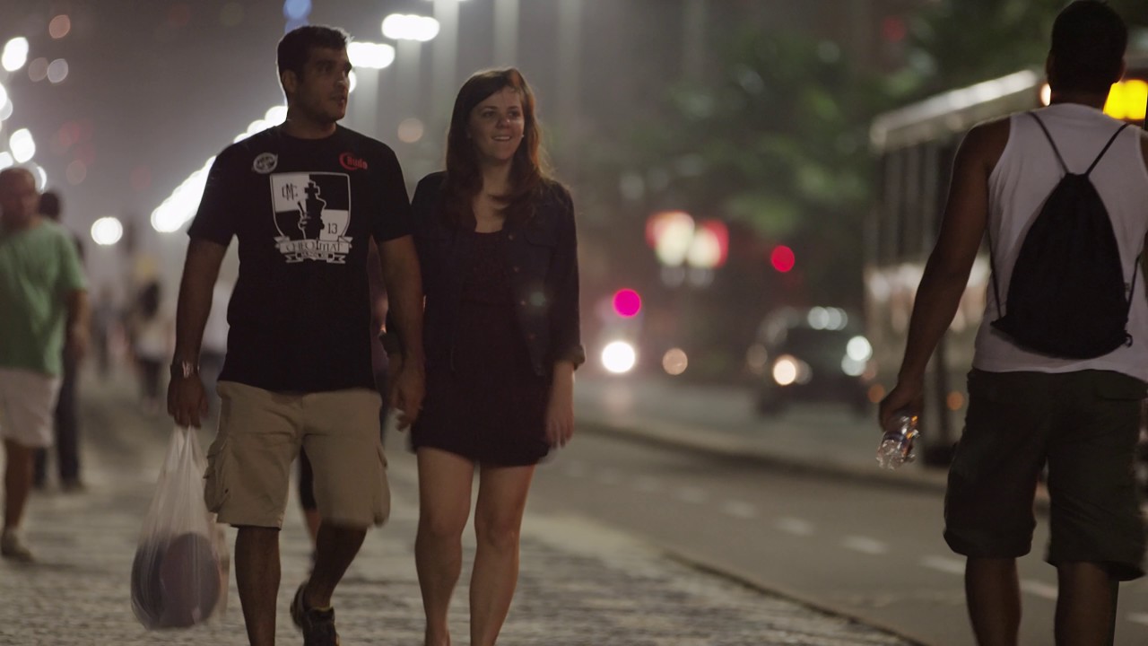 Couple walking and holding hands in Rio.