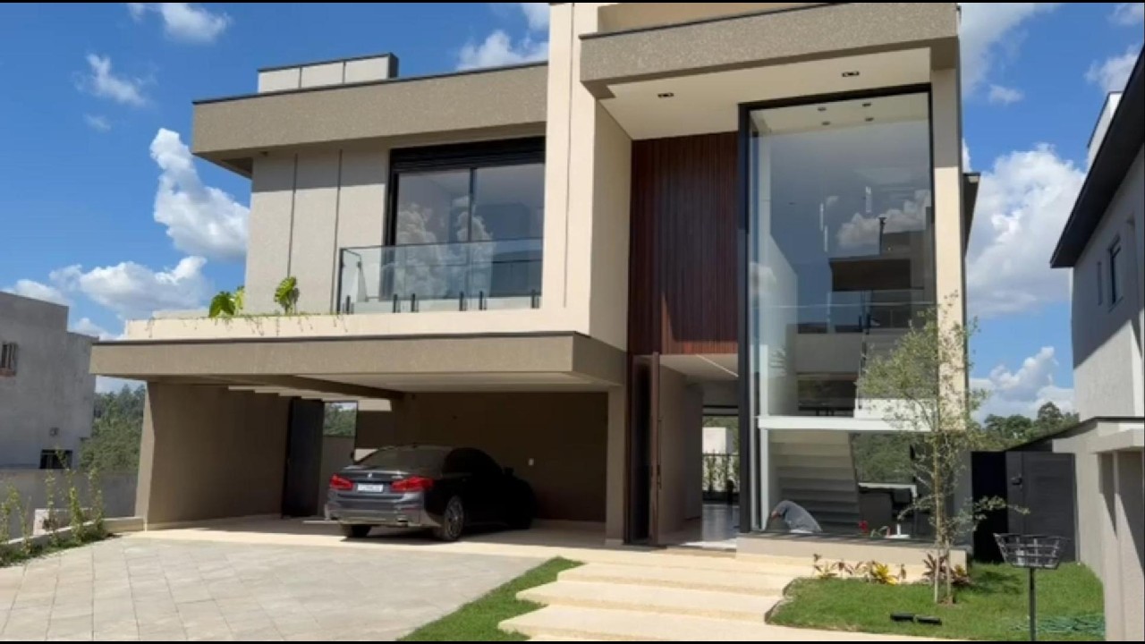 Casa contemporânea - Itahyê | 418 m² a.c. | Vista permanente para a reserva | Alphaville (SP)