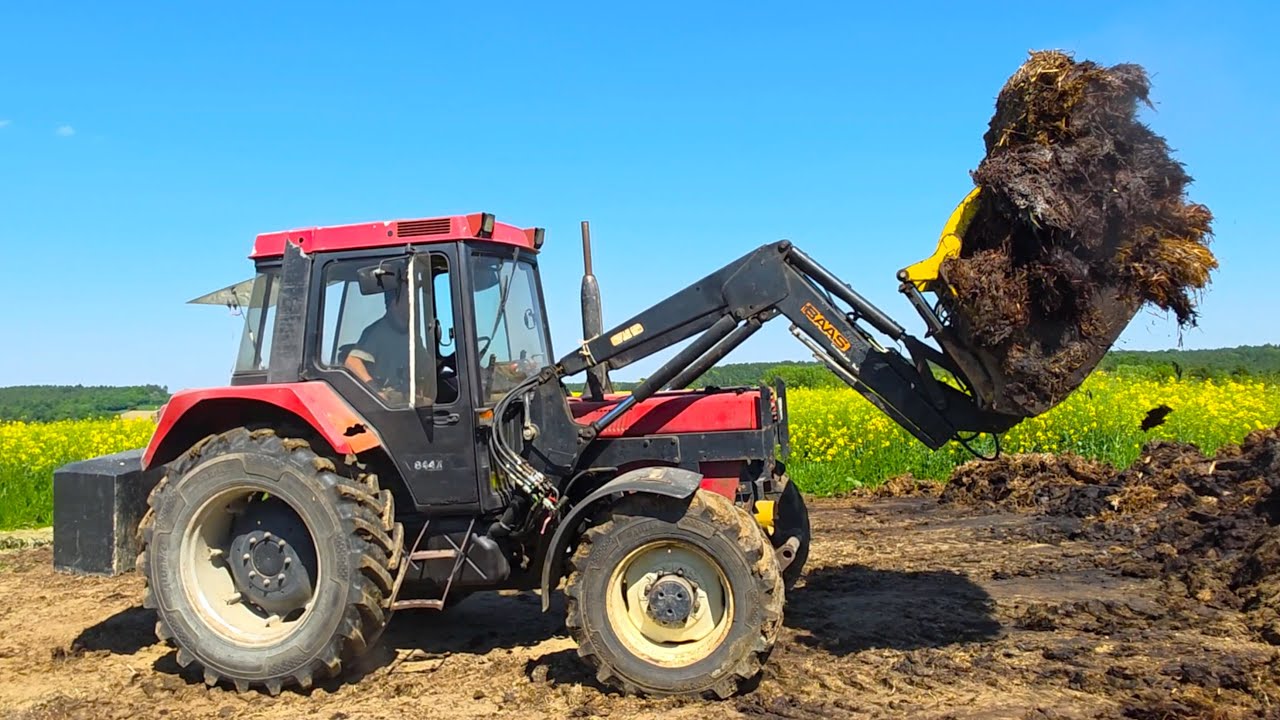 Case 844 XL mit Baas Frontlader beim Mist aufladen! Case MX 100C mit Rollforce 5514 Stalldungstreuer