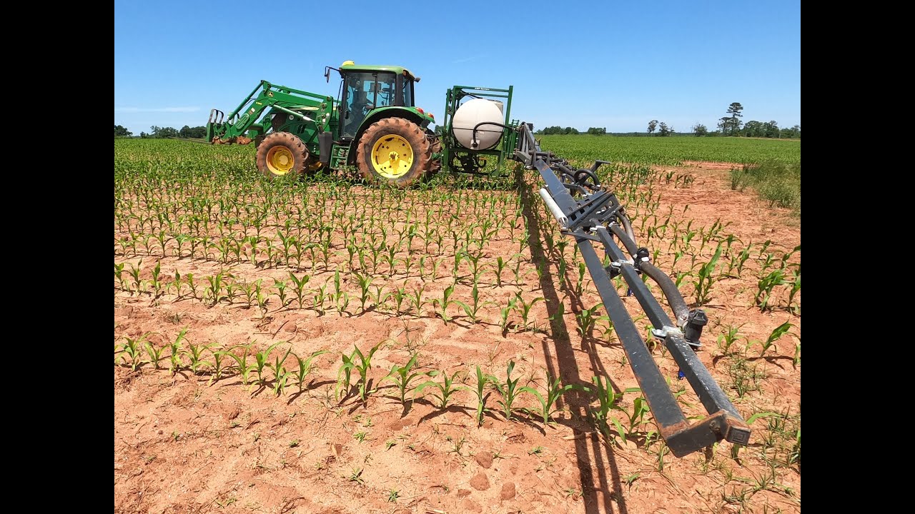Giant Boom Sprayer on a tiny tractor