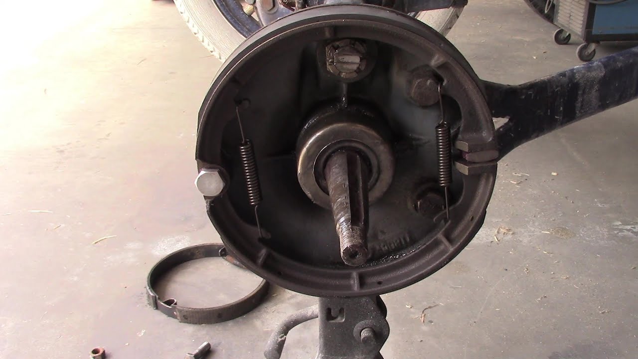 Installing lined Model T brake shoes.