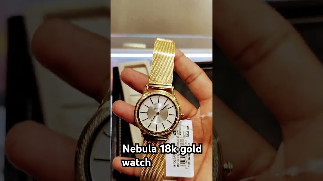 nebula by Titan 18 k gold watches and life time warranty 60 dailamod use