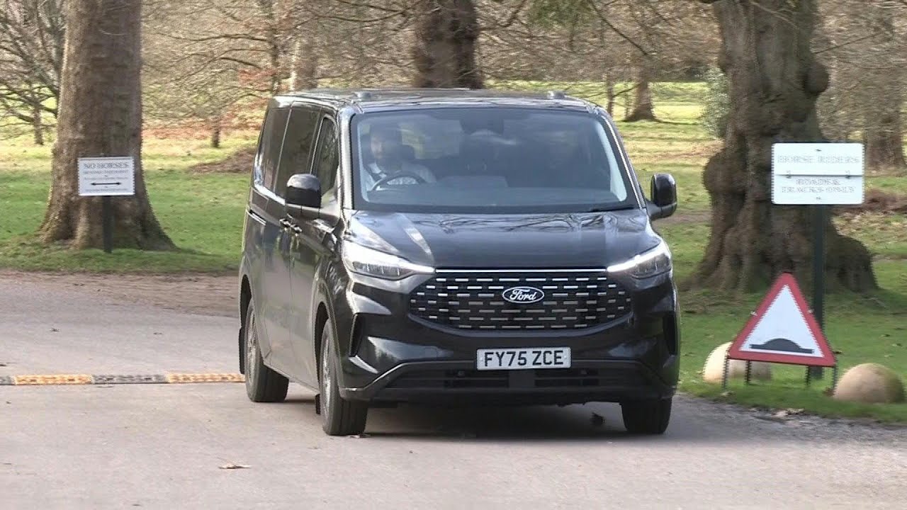 Vans leave ex-prince Andrew's Windsor residence as police expected to continue its search | AFP
