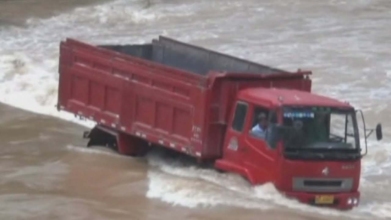 Dramatic rescue as river consumes truck in China