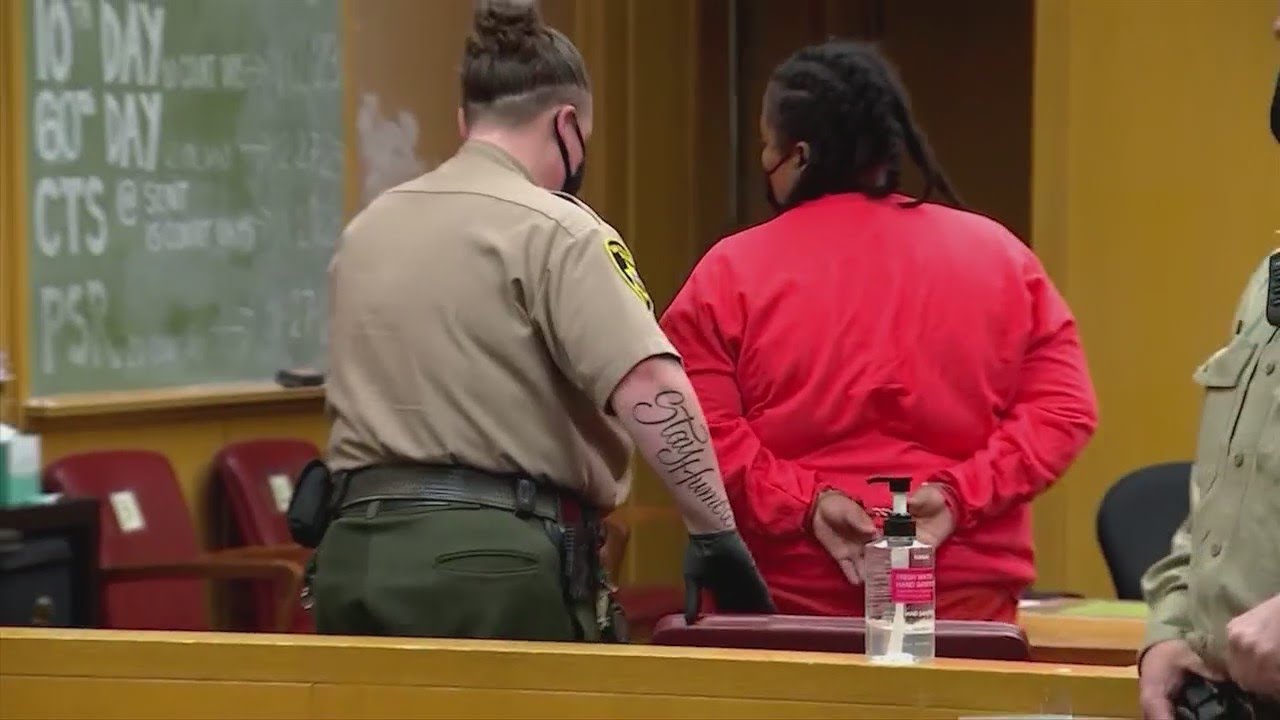 Woman charged with murdering 2 children makes first court appearance