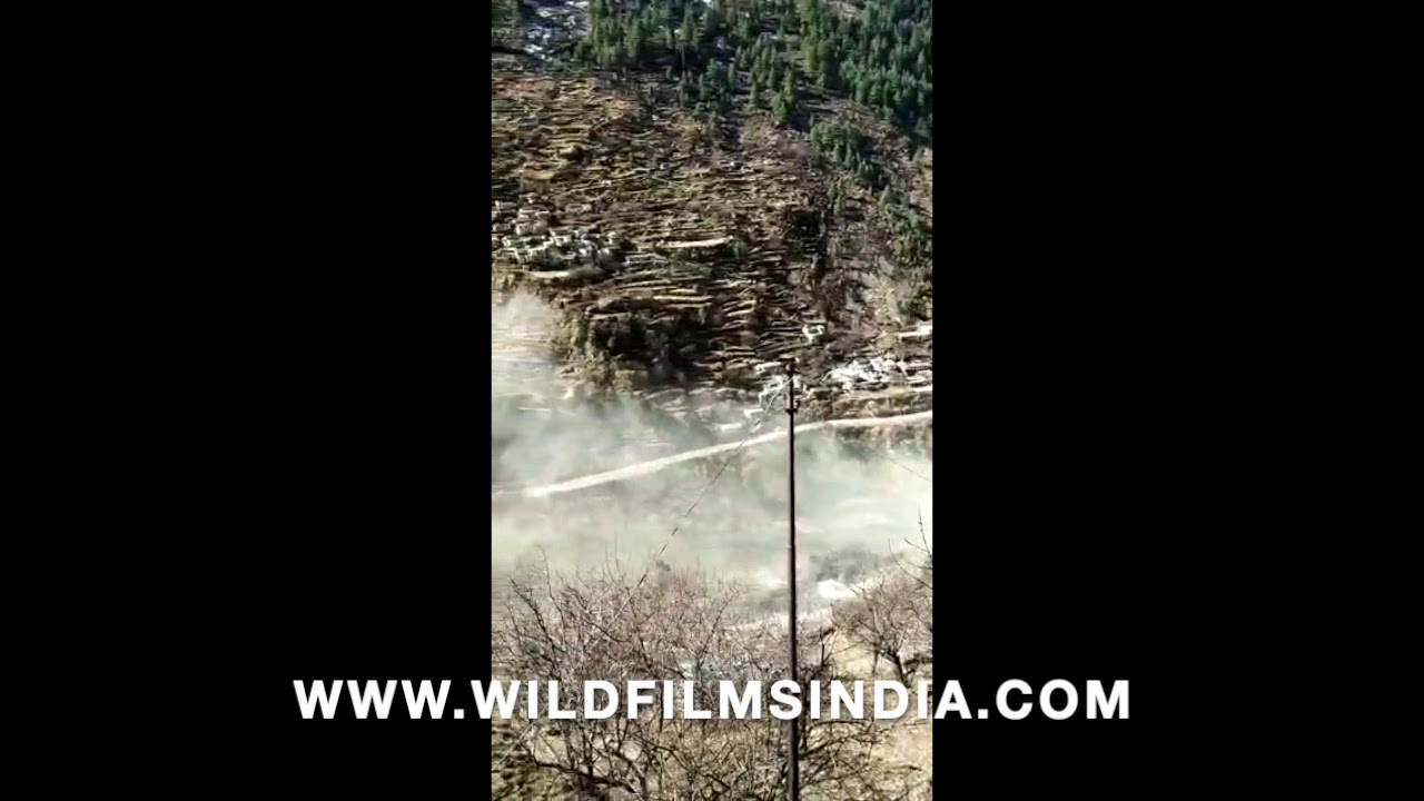 First view of Ganges river flooding over with glacial debris at Chamoli, Uttarakhand: 7 Feb 2021