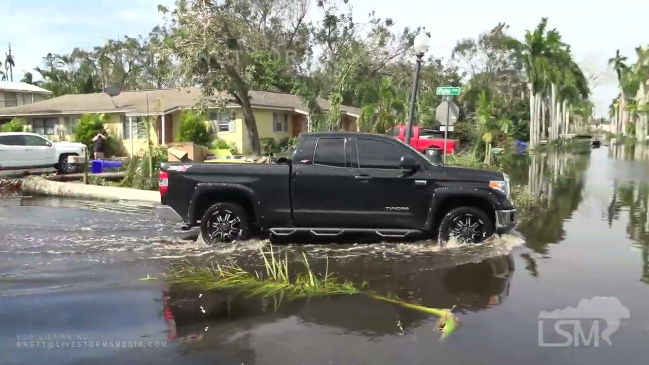 09-29-2022 Fort Myers, FL - Significant Flooding - Vehicle Traffic - Store Lines - Damage