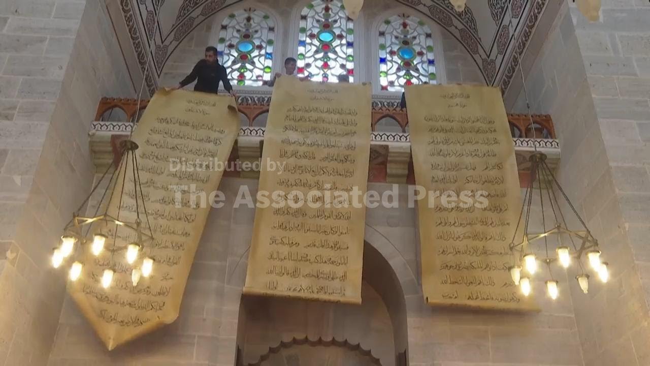 Iraqi calligrapher in Istanbul says his giant hand-written manuscript of the Quran is his pride