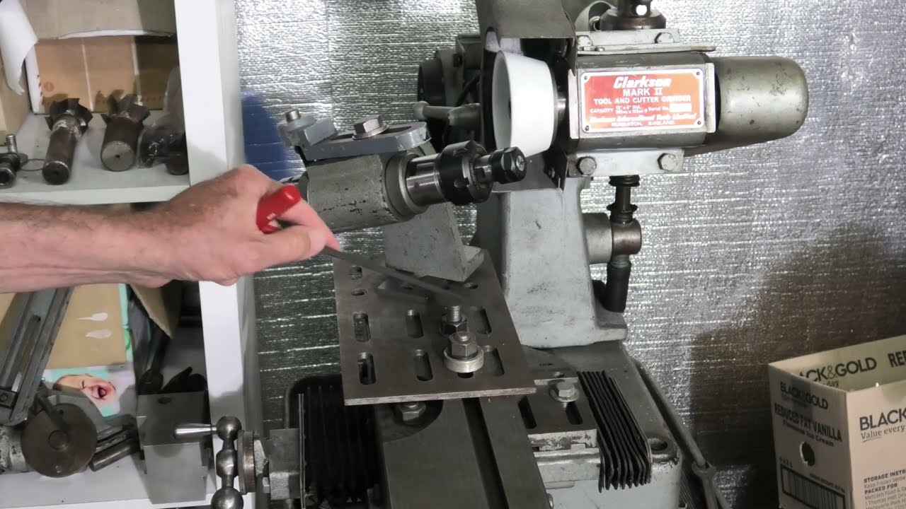 Grinding teeny drills.