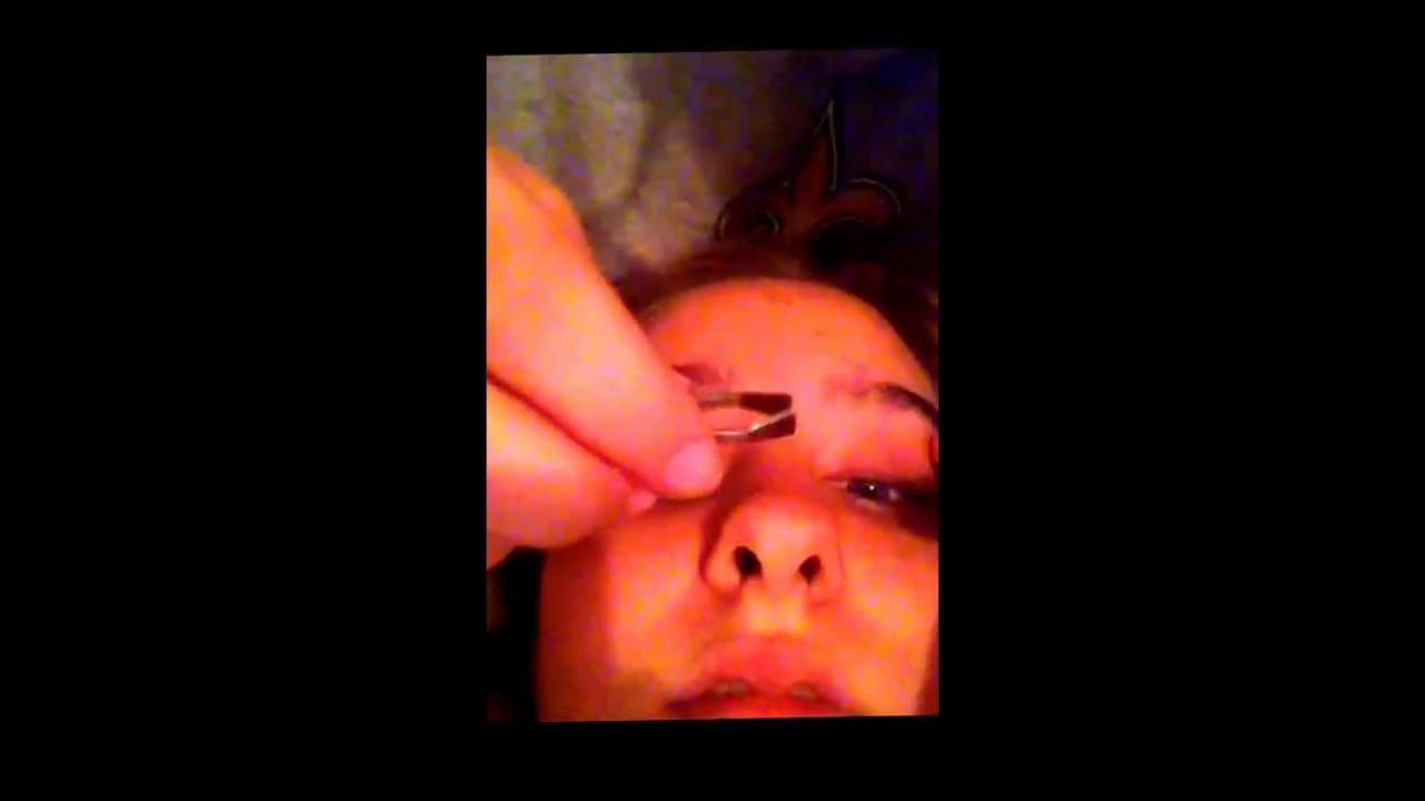 my best friend tweezing my eyebrows
