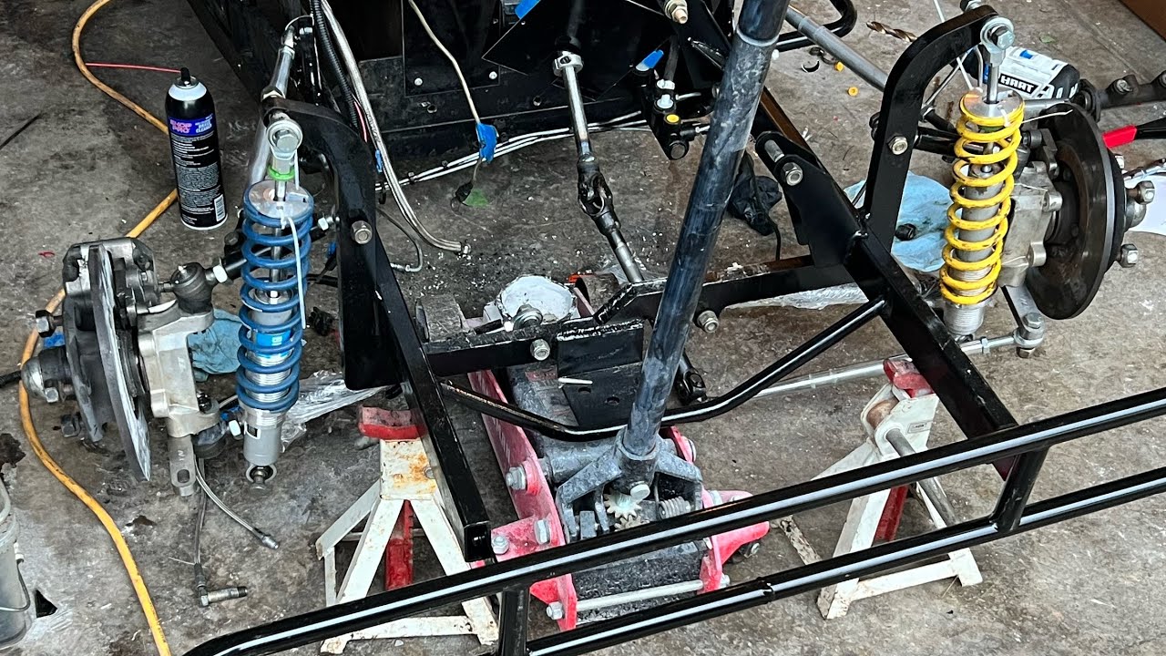 Installing all the front end control arms and suspension on INEX Legend Car