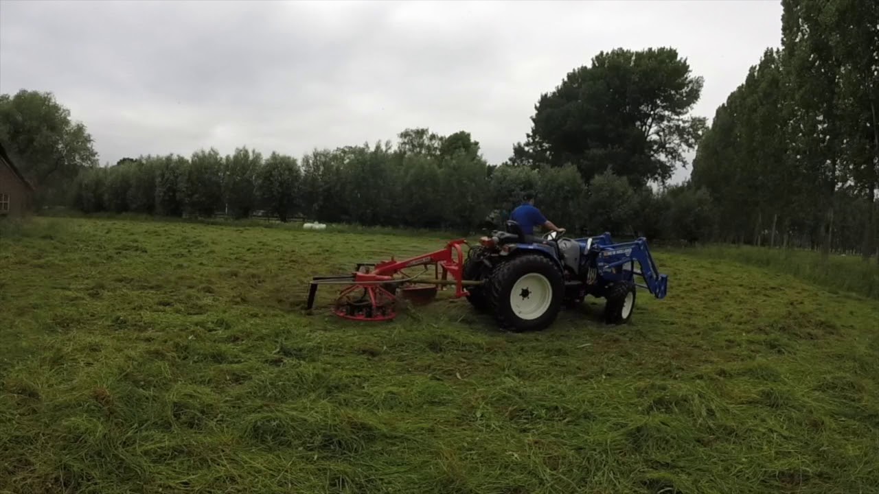 New Holland Boomer 50 with PZ Haybob 300 Raking Hay by DutchHorseGuy