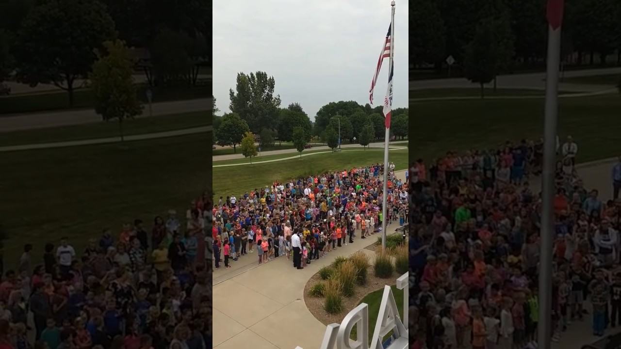 Kinsey Elementary School students and staff recite the Pledge of Allegiance