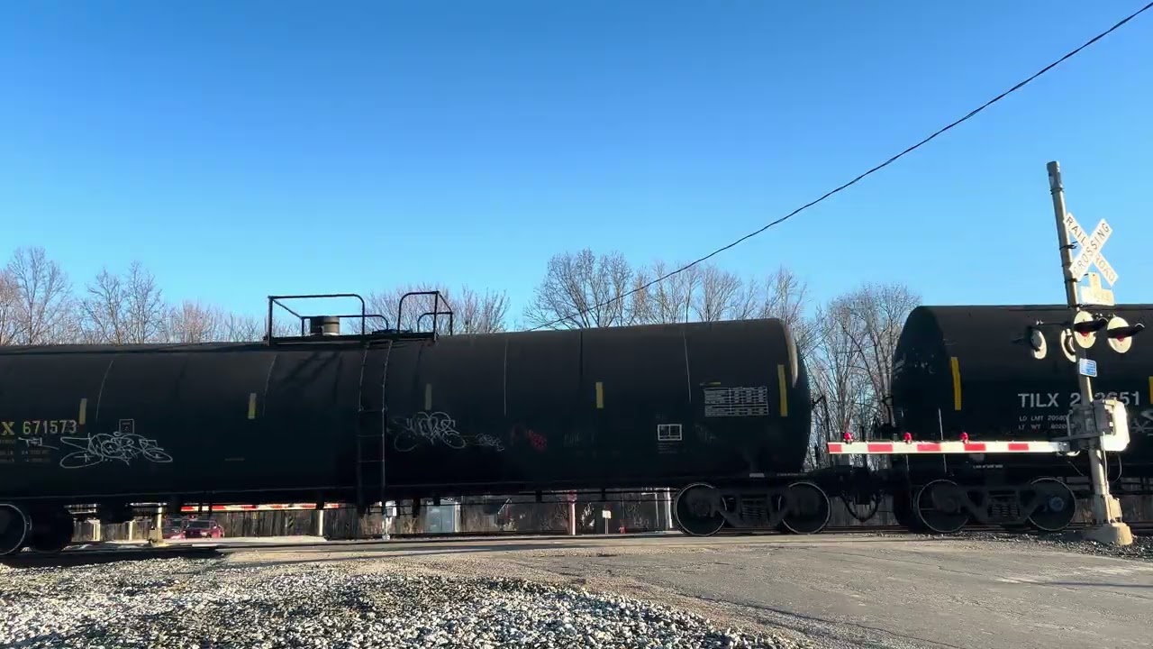 Fresh CSX CM44 leads a freight with a lot of new  covered hoppers in Perry, OH