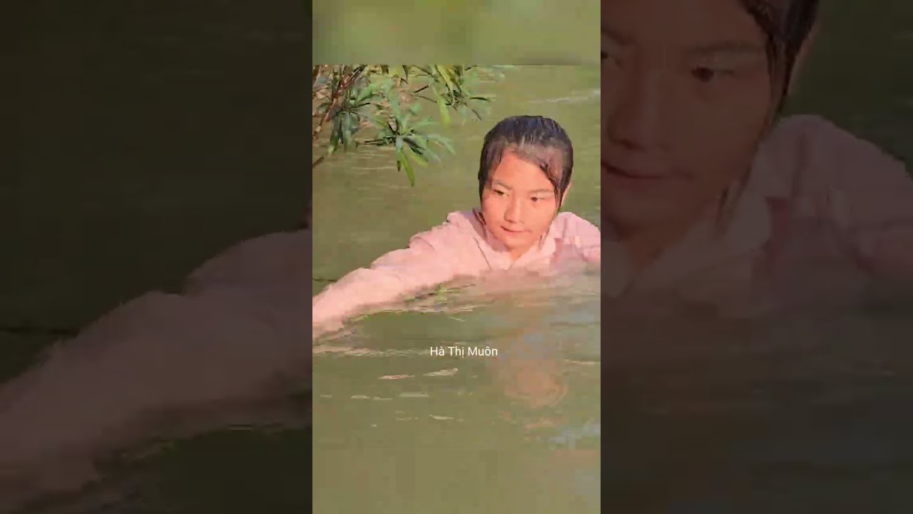 A young Vietnamese woman earns a living by fishing with her dog and goat. ha Thi Muon#hathimuon#harv