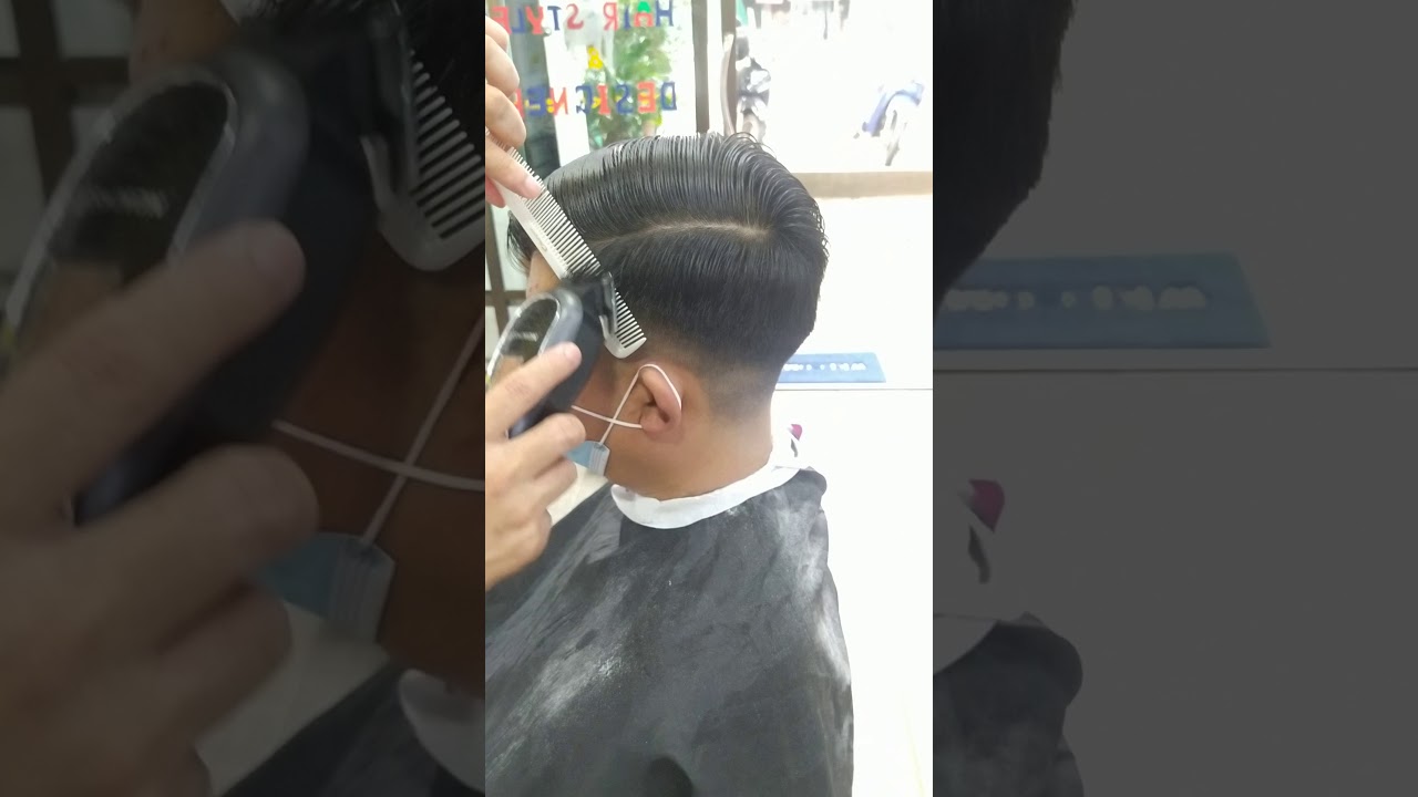 man cutting hair style