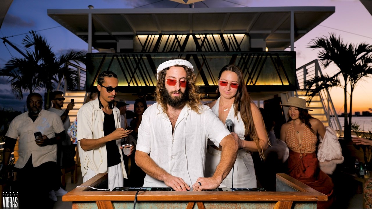 playing house music on a boat until people dance