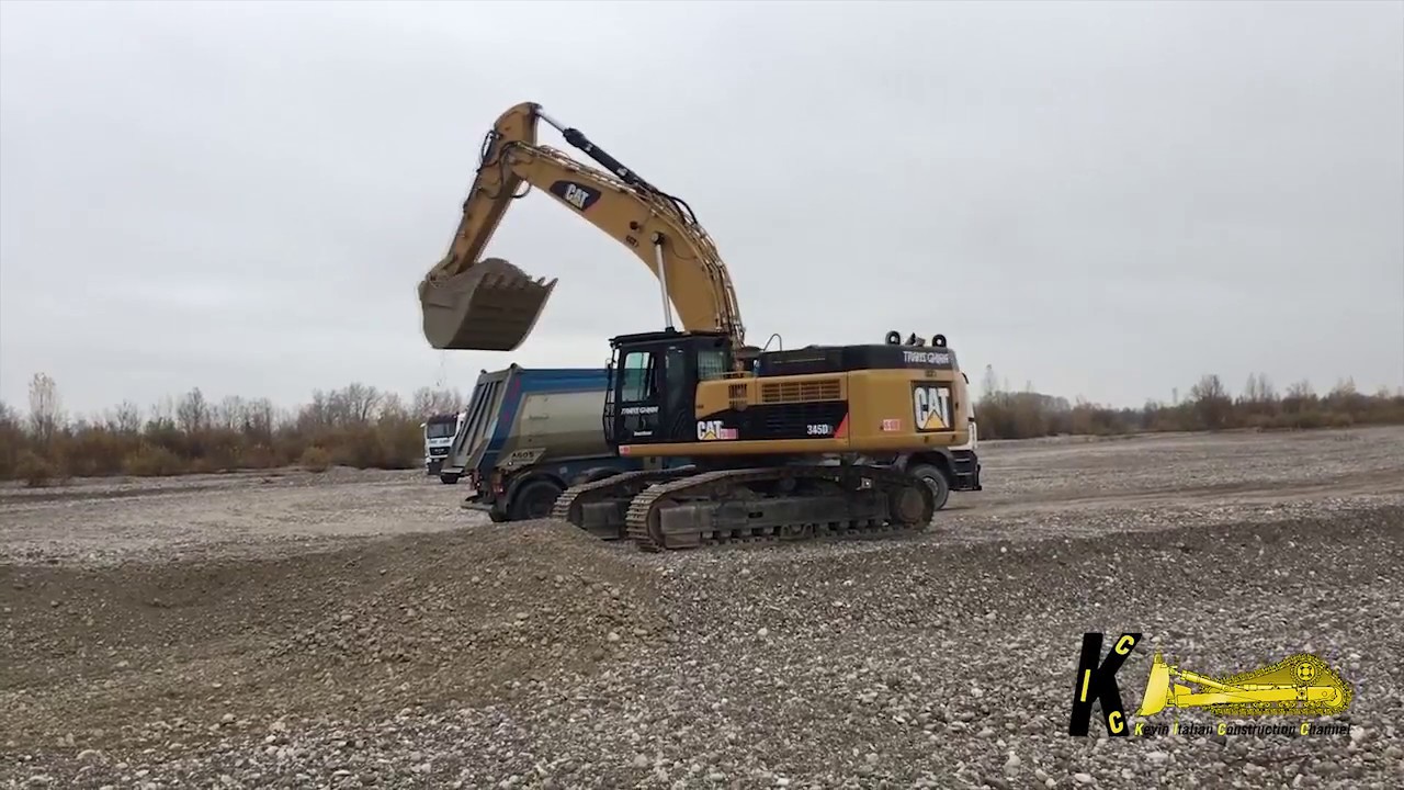 Caterpillar 345D Loading Man Trucks