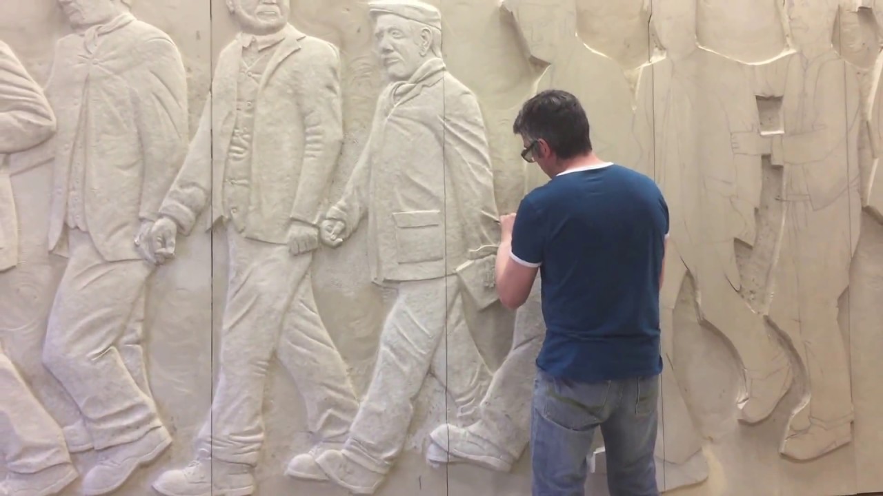 Graeme Mitcheson carving a large scale stone sculpture
