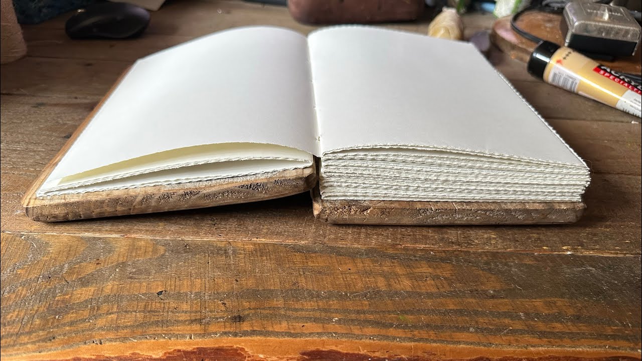 Coptic stitch wood journal binding process. Book binding.