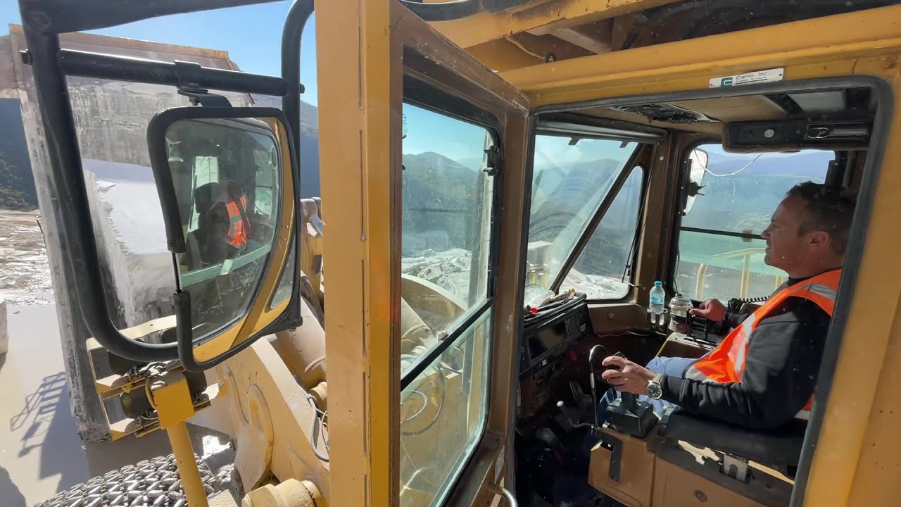 MMC Owner Operates Caterpillar 992D Wheel Loader Loading Marble Blocks On Caterpillar Dumpers