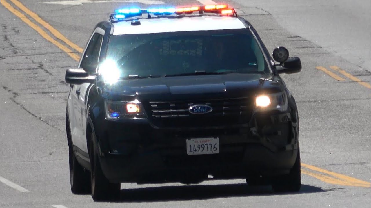 Police Car, Fire Trucks and Ambulances responding with siren and lights