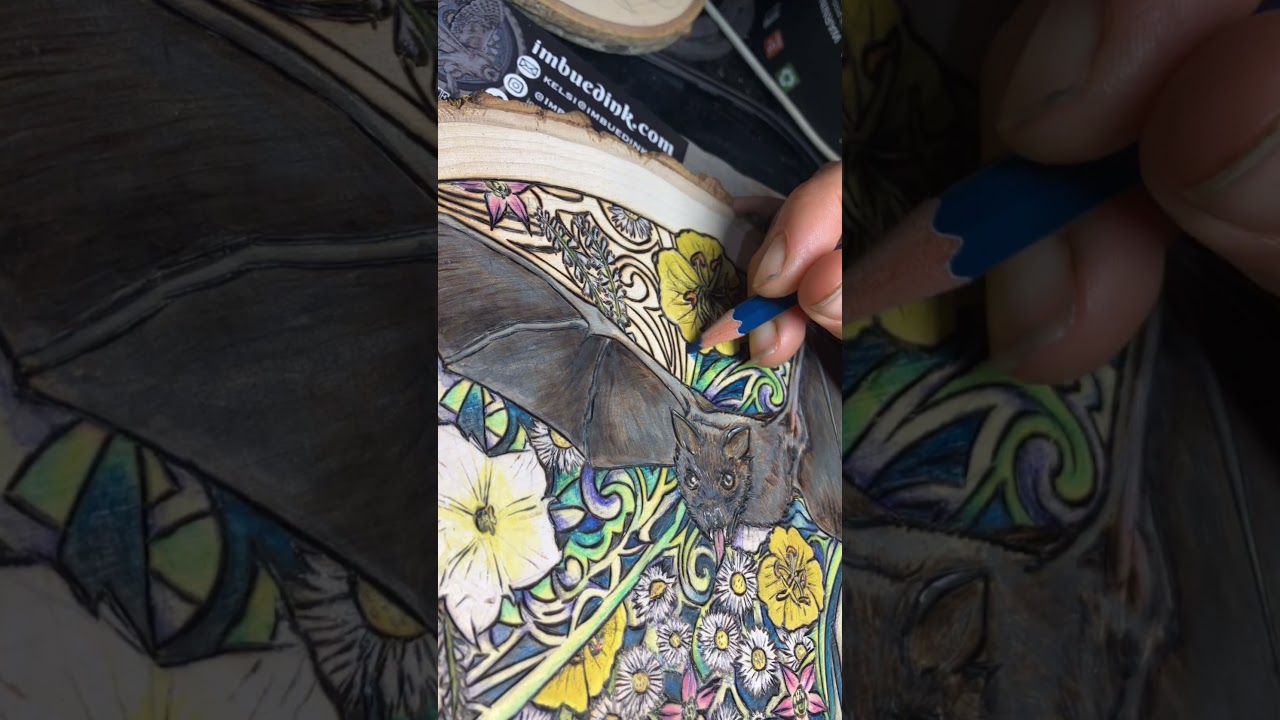 Adding color to my wood burned drawing art “Batty” 