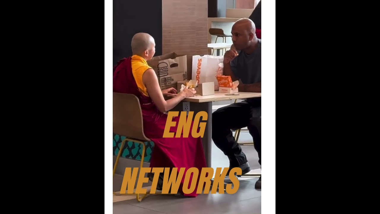 Wallo having a conversation with a monk 
