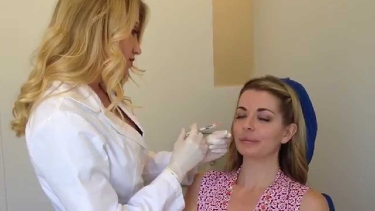 Dr. Power injects filler on patient to lift cheeks and help with volume loss