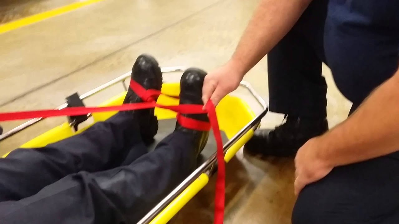 Patient strapped to Stokes