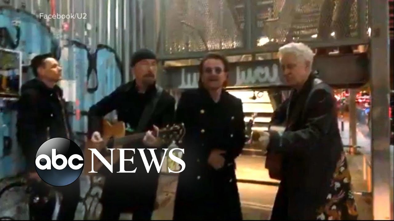 U2 performs a surprise pop-up concert on NYC street corner