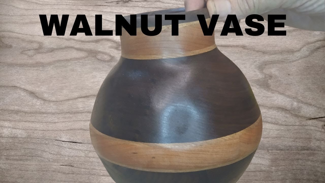 A Walnut And Cherry Vase Made With Rings Cut On A Scroll Saw