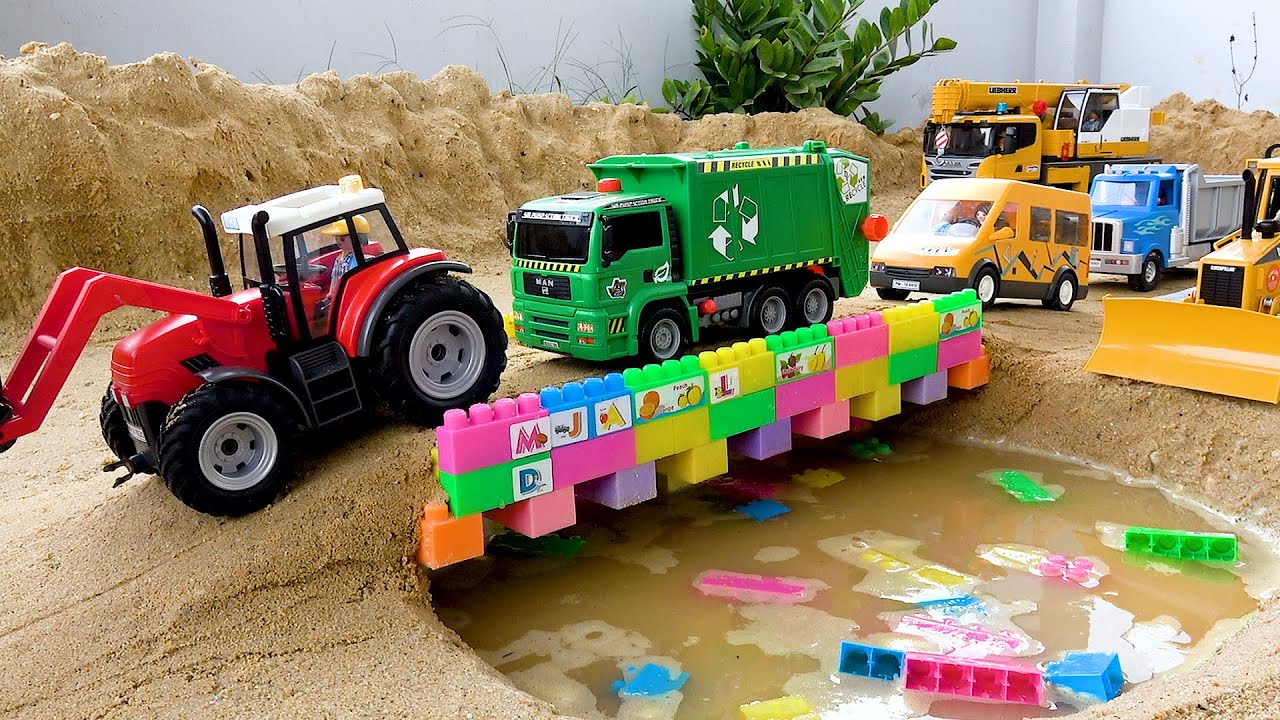 Traktor policyjny i koparka do budowy mostu