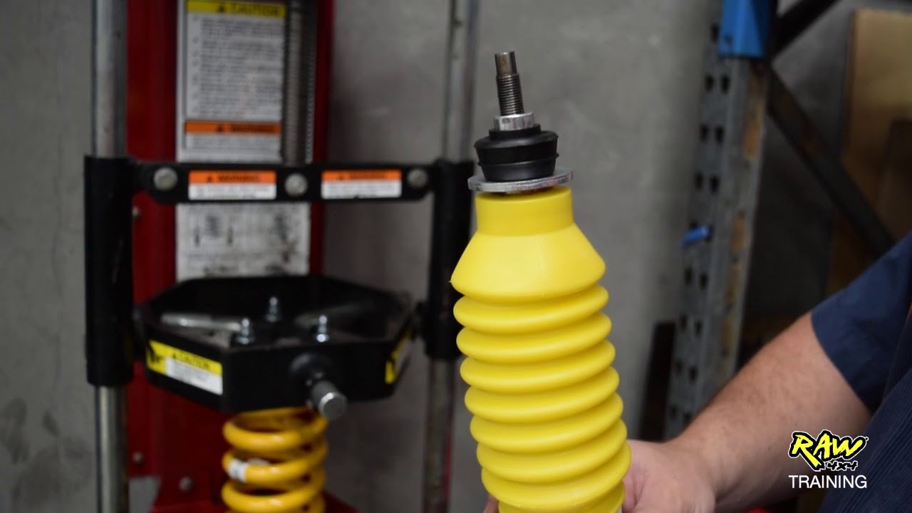 How to assemble a strut with top hat & coil spring