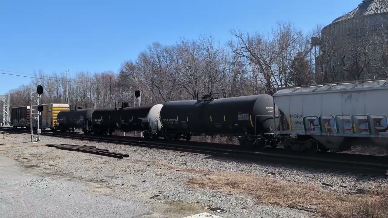 CSX 4732 and CSX 66 lead a south bound mixed freight by the Selma Amtrak station in Selma, N.C.