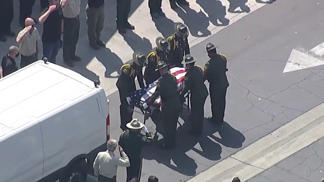 Crews and residents salute fallen firefighter during procession.mp4