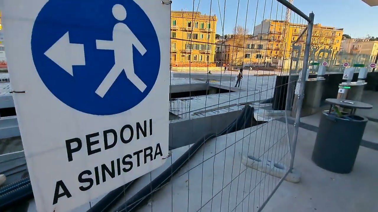 Laying slabs with a crane at the railway station in Matera, Italy.