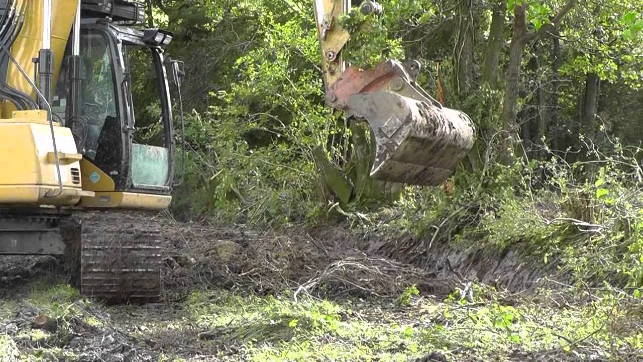Cat 311c Excavator Digging Drains.