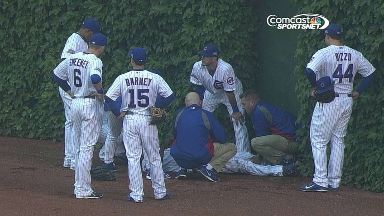 WSH@CHC: Lake slides into outfield wall, exits game